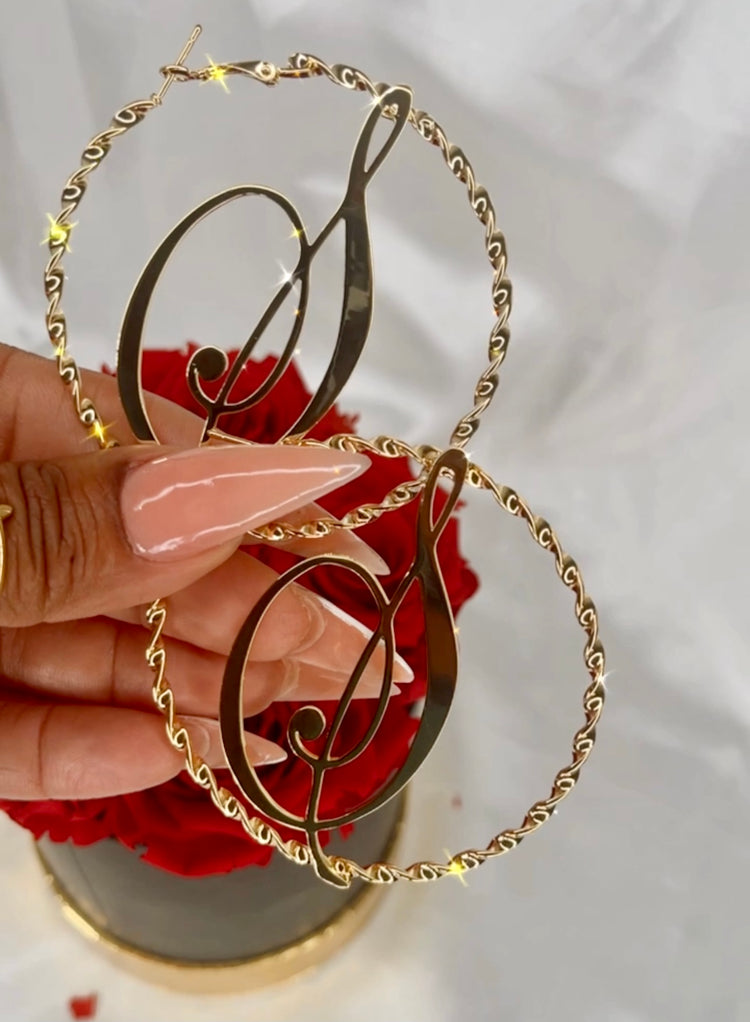 Twisted initial hoop earrings